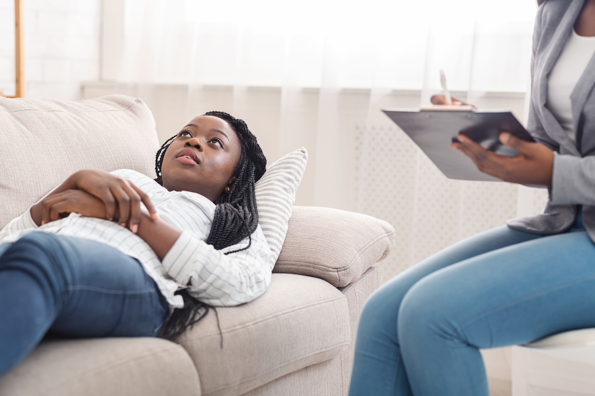 A woman lying down during hypnotherapy in Los Angeles.